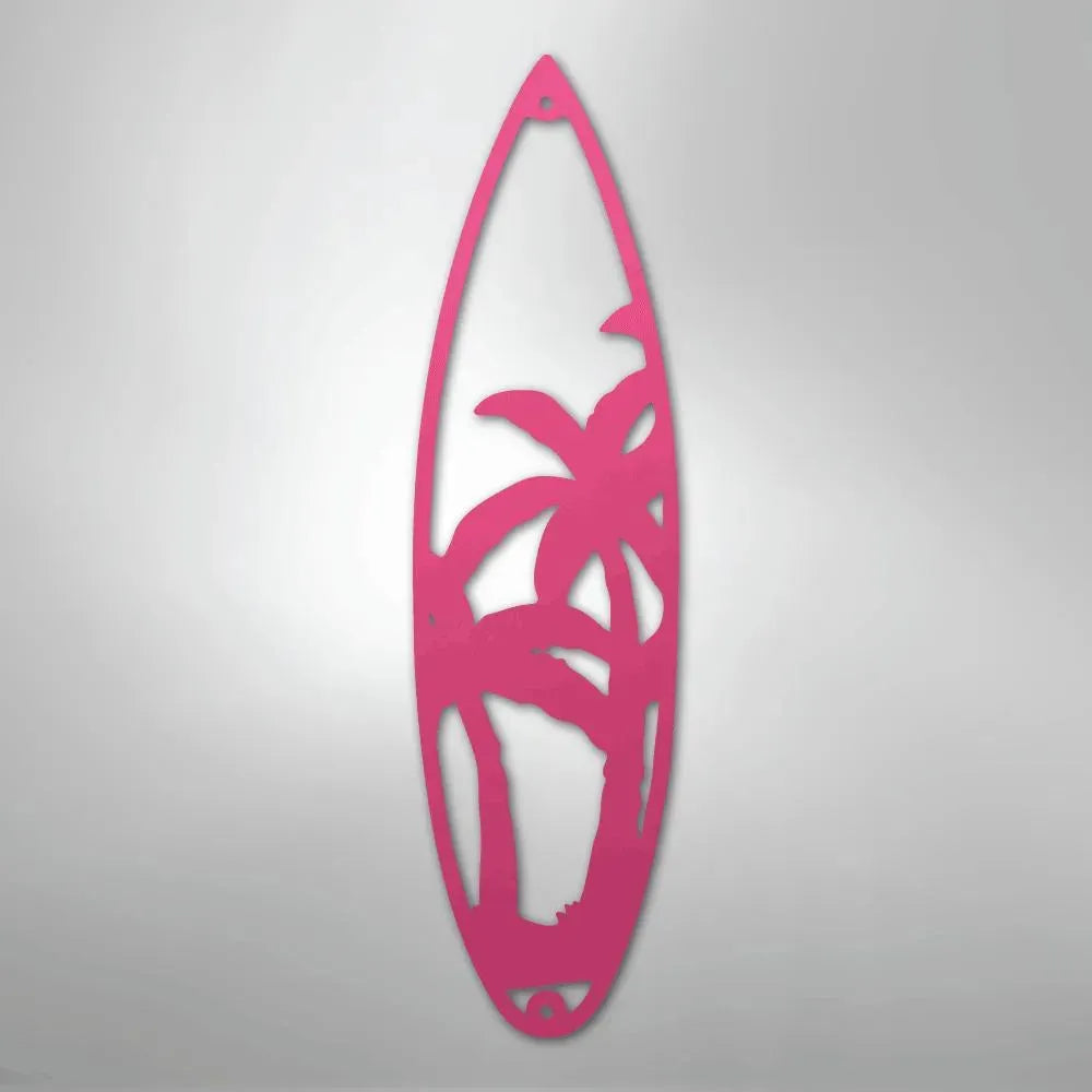 Pink metal surfboard wall art with palm tree cutouts, powder-coated for indoor/outdoor decor.