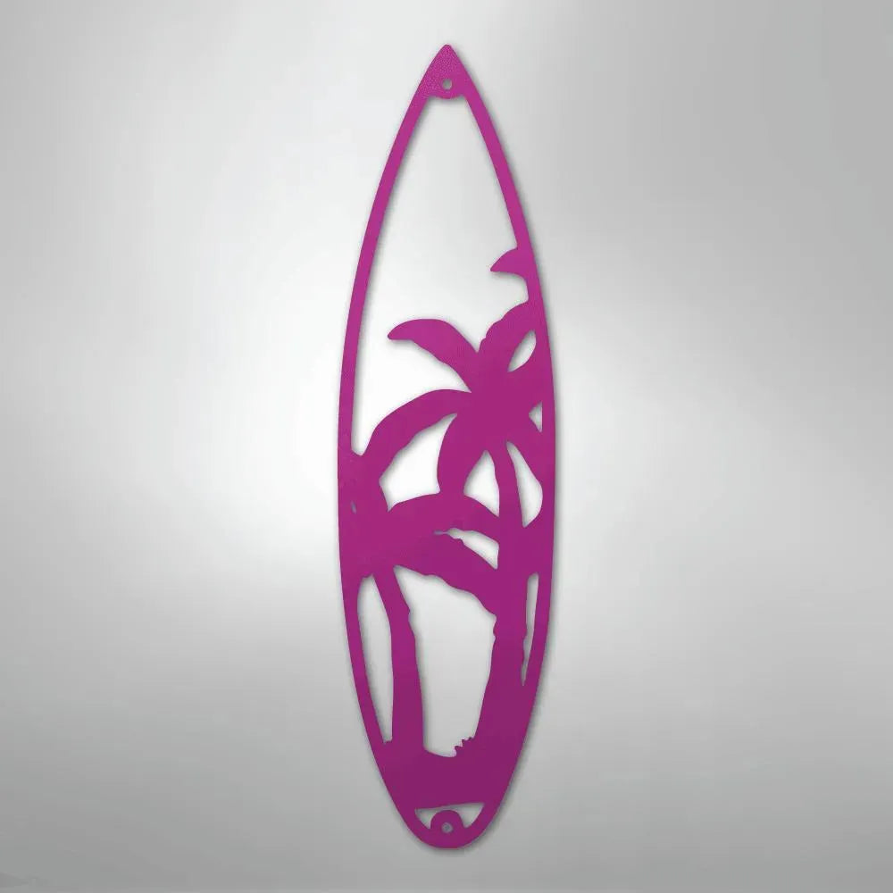 Pink metal surfboard wall art with palm tree cutouts, powder-coated for indoor/outdoor decor.