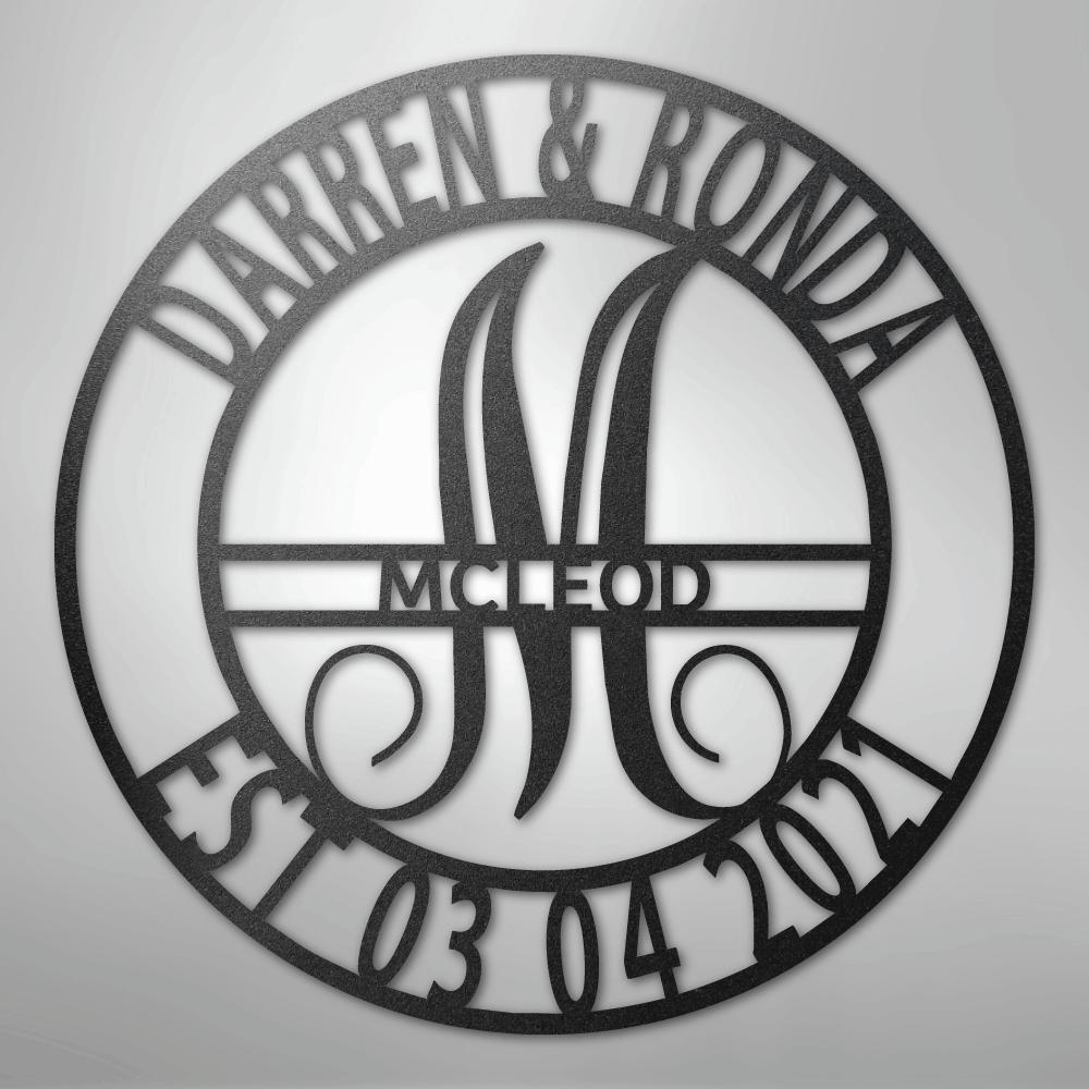 Black metal family name wall art with "Darren & Ronda," a large "M," "McLeod," and "Est. 03 04 2021" in a circular design.