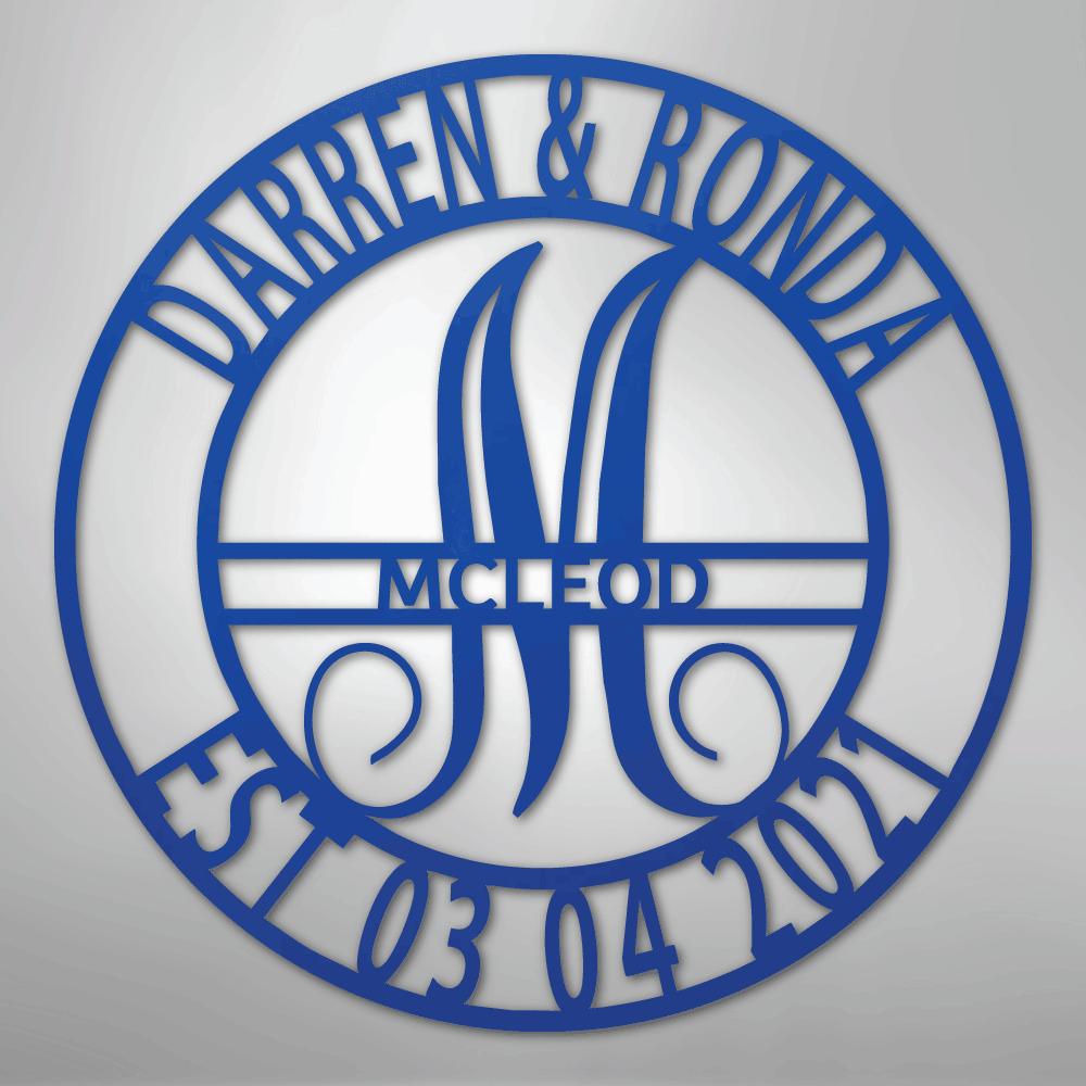 Blue metal family name wall art with "Darren & Ronda," a large "M," "McLeod," and "Est 03 04 2021" in a circular design.