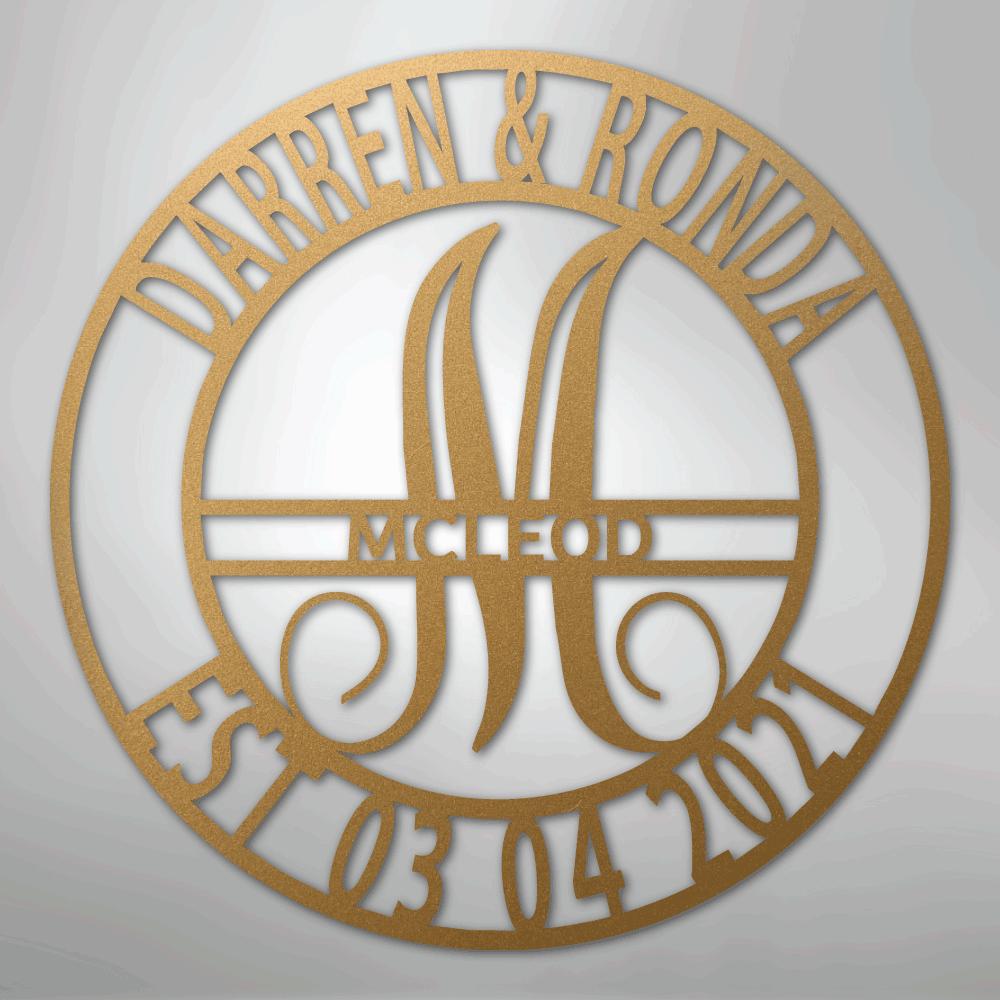 Gold metal family name wall art with "Darren & Ronda," a large "M," "McLeod," and "Est. 03 04 2021" in a circular design.