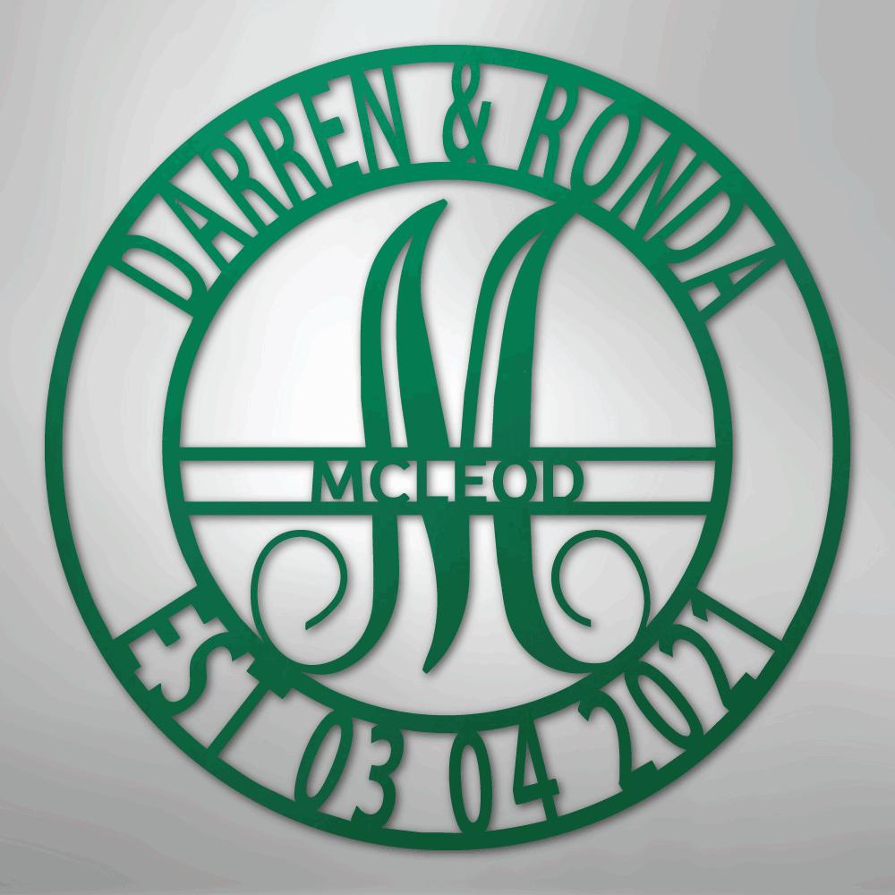 Green metal family name wall art with "Darren & Ronda," a large "M," "McLeod," and "Est 03 04 2021" in a circular design.