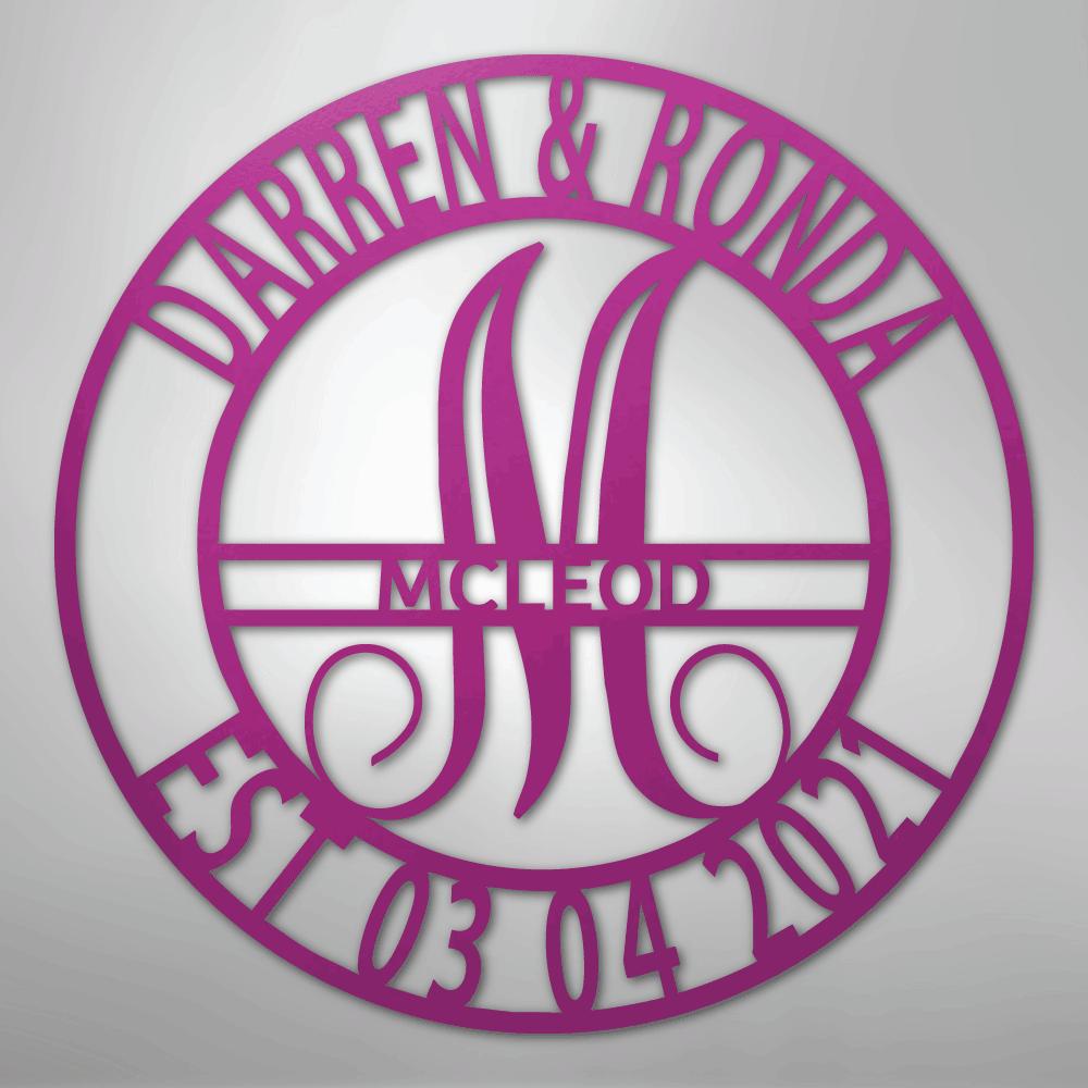 Pink metal family name wall art with "Darren & Ronda," a large "M," "McLeod," and "Est. 03 04 2021" in a circular design.