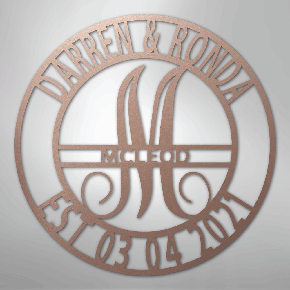 Rose gold metal wall art with "Darren & Ronda," a large "M," "McLeod," and "Est. 03.04.2021" in a circular design.