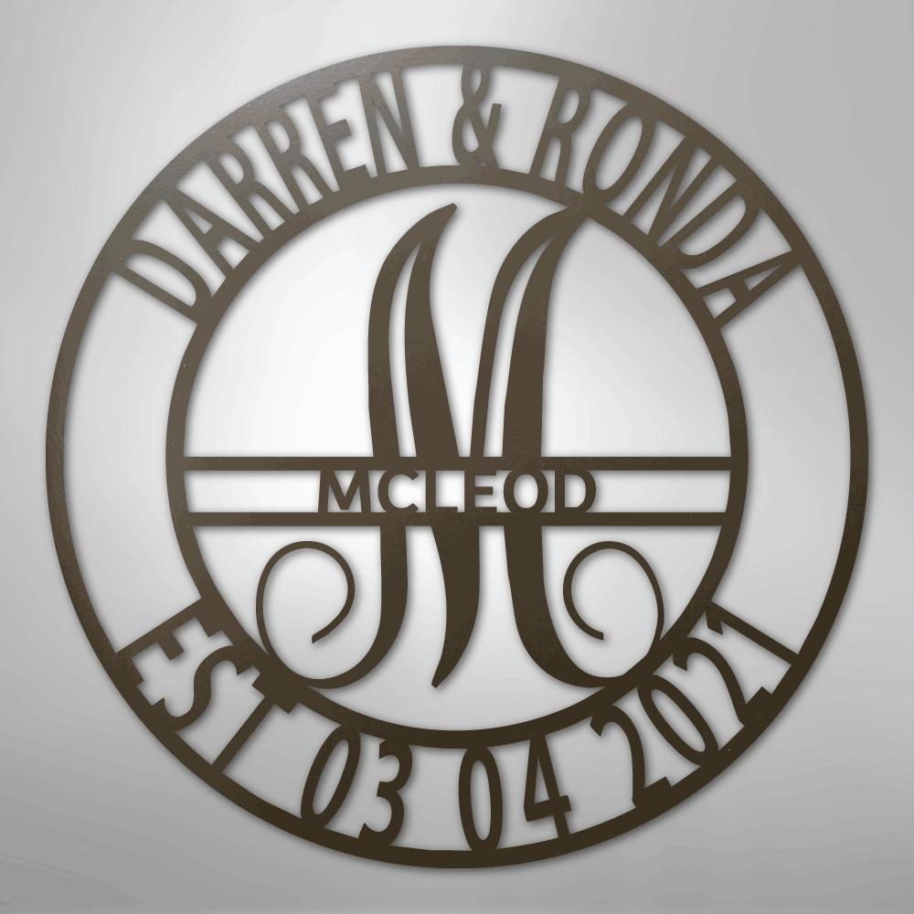 Round brown metal family name wall art with "Darren & Ronda," a large "M," "McLeod," and "Est 03 04 2021.