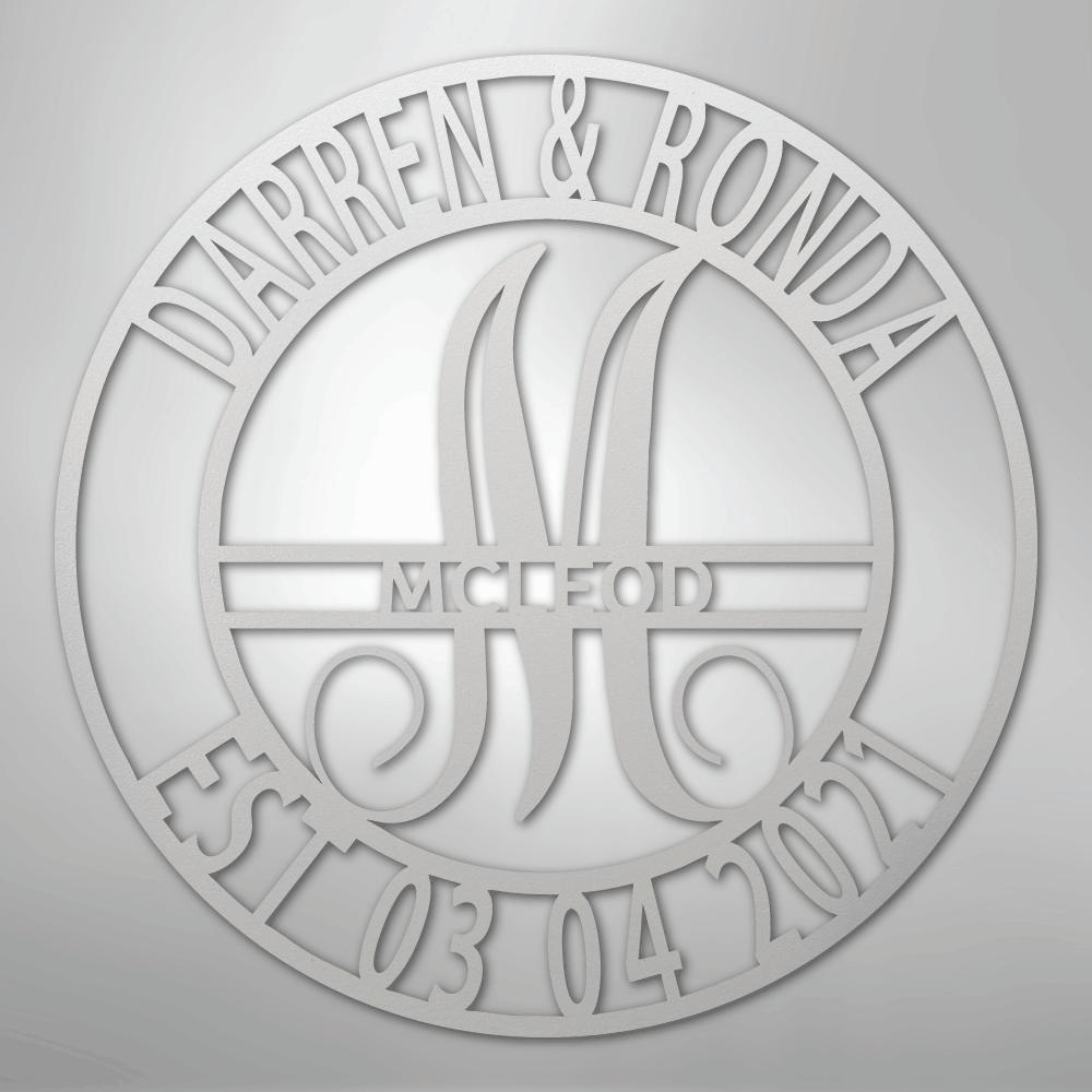 Custom silver metal wall art with "Darren & Ronda," a large "M," "McLeod," and "Est 03 04 2021" in a circular design.