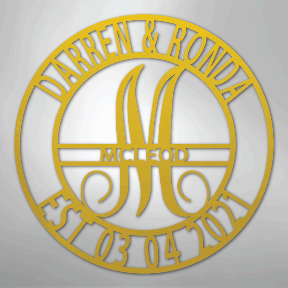 Gold metal wall art with "Darren & Ronda," a large "M" for McLeod, and "Est. 03.04.2021" in a circular design.