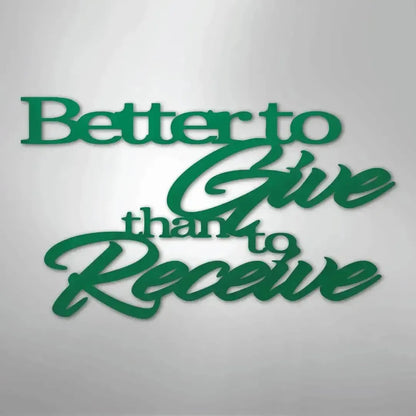 Green "Better to Give than to Receive" metal wall art with mixed fonts, casting a shadow on a light background.
