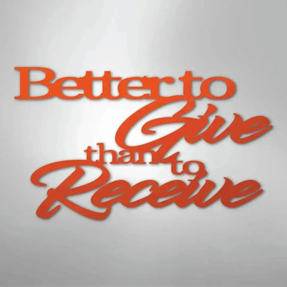 Orange metal wall art with "Better to Give than to Receive" in script and block fonts.