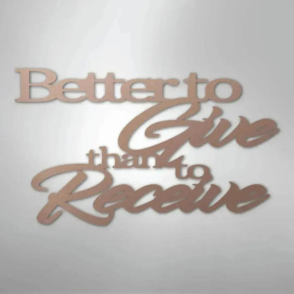 Rose gold metal wall art with "Better to Give than to Receive" quote in elegant script.