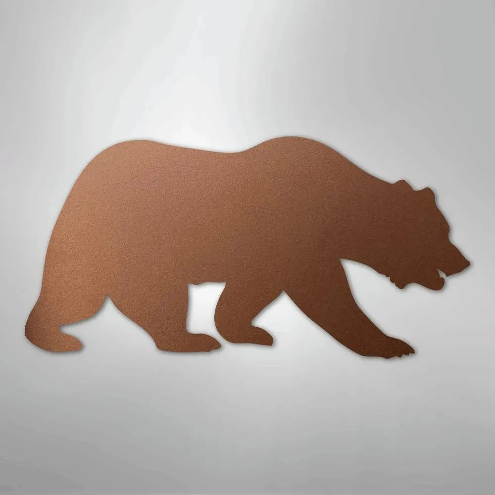 Brown metal wall art silhouette of a walking grizzly bear with a textured finish.