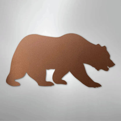 Brown metal wall art silhouette of a walking grizzly bear with a textured finish.