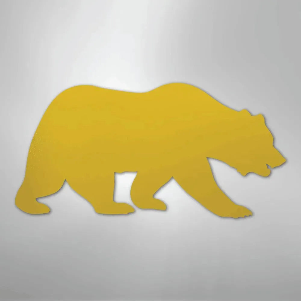 Golden grizzly bear metal wall art, a silhouette of a walking bear.