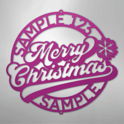 Pink metal Christmas ring wall art with "Merry Christmas" script and snowflake accent.