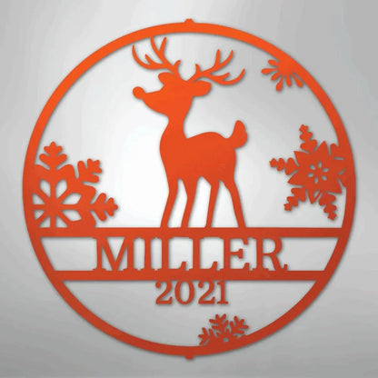 Orange metal wall art with a reindeer, snowflakes, and "MILLER 2021" text in a circular design.