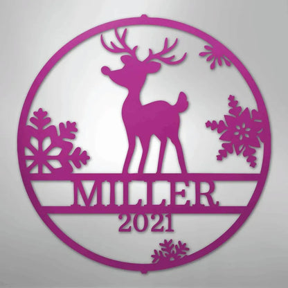 Pink metal Rudolph reindeer wall art with snowflakes, "MILLER 2021" custom text, and a circular frame.