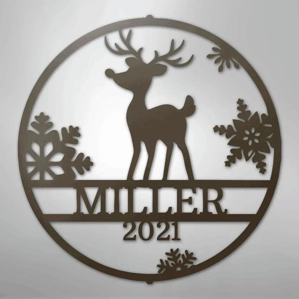 Brown metal wall art with a reindeer, snowflakes, and "MILLER 2021" text in a circular design.