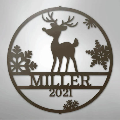Brown metal wall art with a reindeer, snowflakes, and "MILLER 2021" text in a circular design.