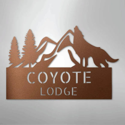 Copper metal wall art featuring mountains, pine trees, a howling coyote, and "COYOTE LODGE" text.