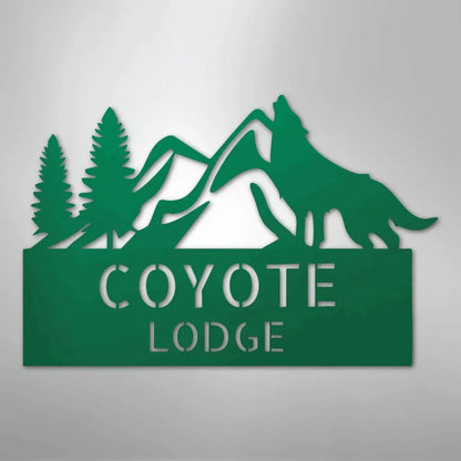 Green metal wall art featuring mountains, pine trees, a howling wolf, and "COYOTE LODGE" text.