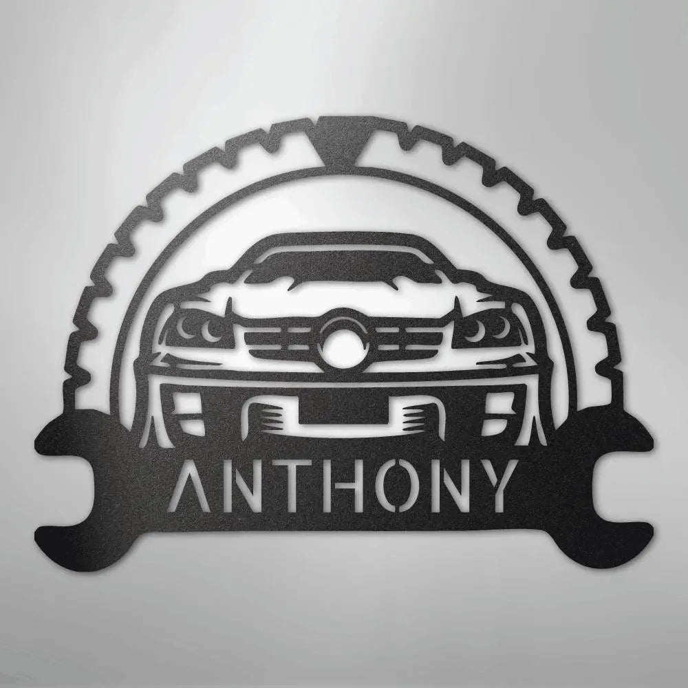 Black metal classic car monogram with "ANTHONY" text, gear, and wrench design.
