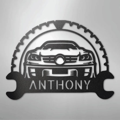 Black metal classic car monogram with "ANTHONY" text, gear, and wrench design.