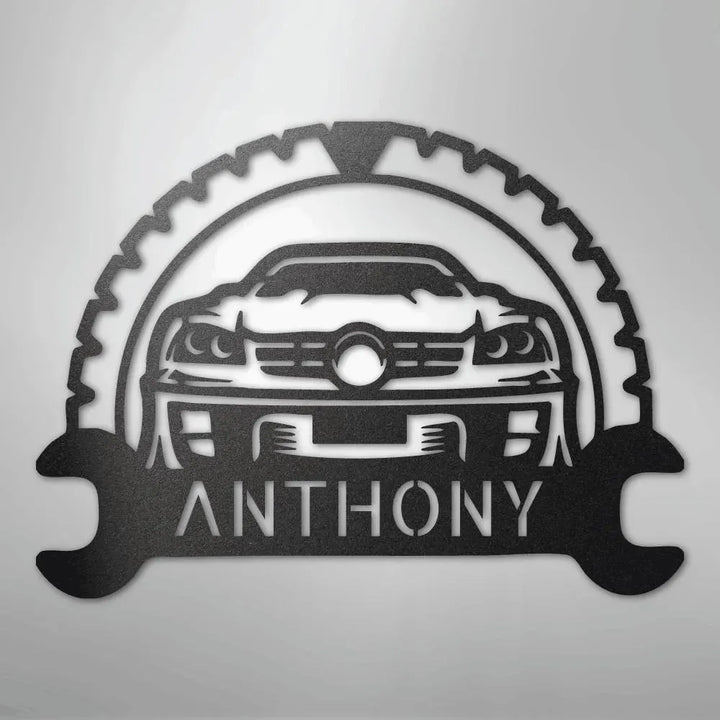 Black metal classic car monogram with "ANTHONY" text, gear, and wrench design.