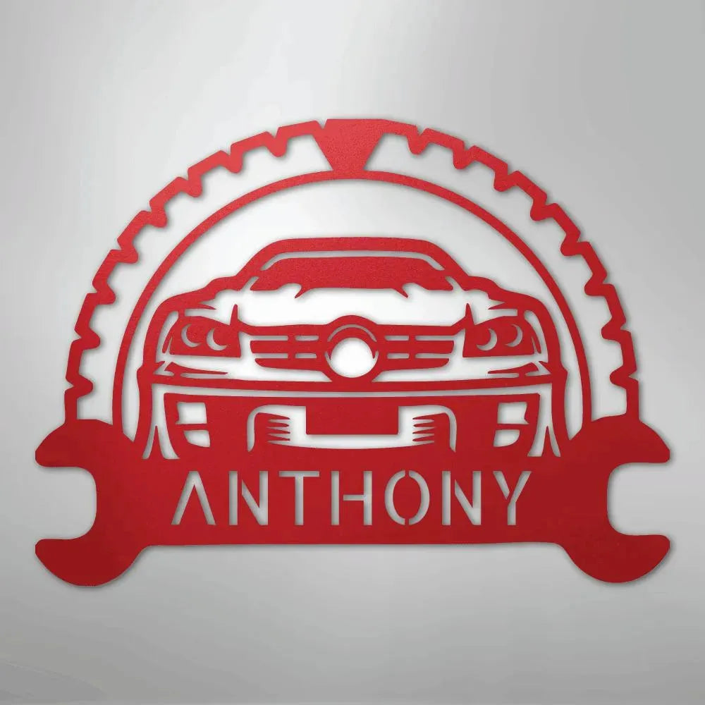 Red metal classic car monogram with custom name "ANTHONY" and gear/wrench design.