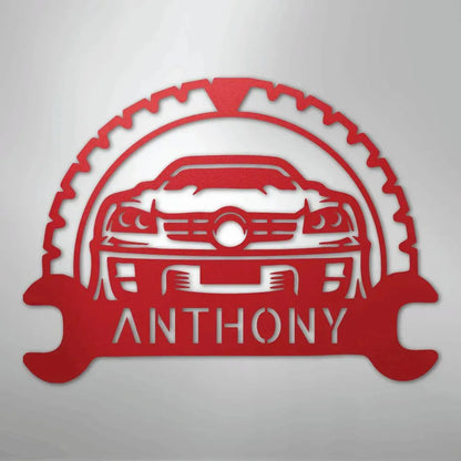 Red metal classic car monogram with custom name "ANTHONY" and gear/wrench design.
