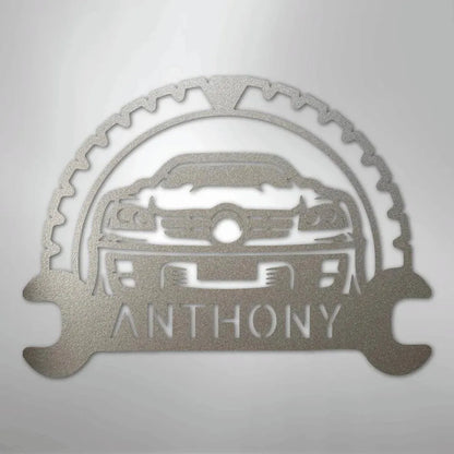 Silver metal custom car monogram wall art with "ANTHONY" text, gear, and wrench details.