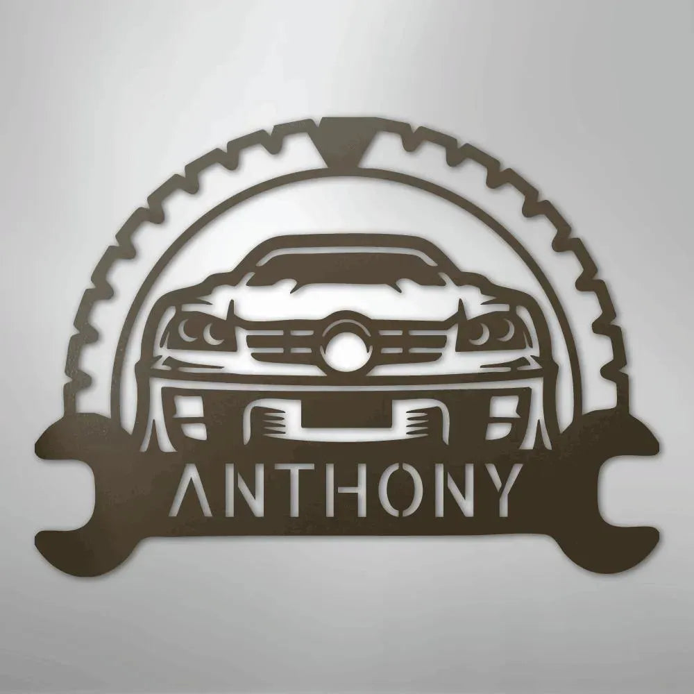 Brown metal classic car monogram with "ANTHONY" text, gear, and wrench details.