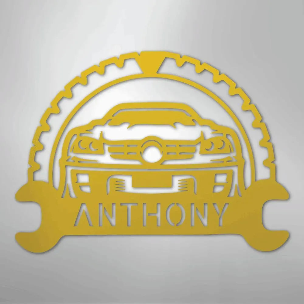 Yellow metal classic car monogram with custom name "ANTHONY" and gear/wrench design.