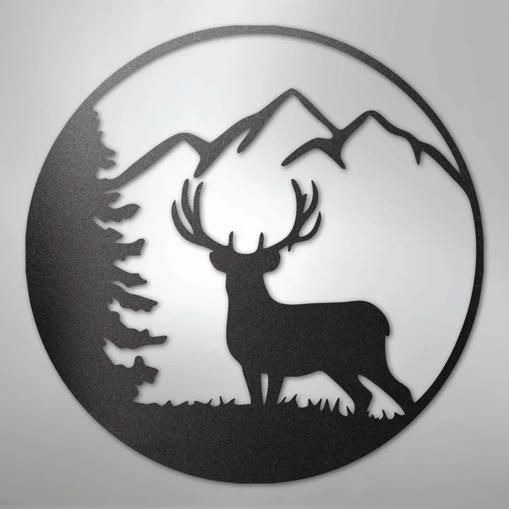 Black metal wall art featuring a graceful deer, pine tree, and mountains within a circular design.