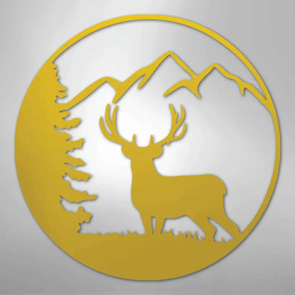 Graceful gold metal wall art featuring a deer, pine tree, and mountains within a circular frame.
