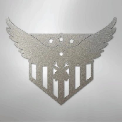 Silver metal wall art featuring a swooping eagle with three stars and a striped shield design.