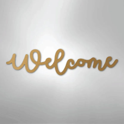 Gold script metal wall art spelling "Welcome" in a flowing, elegant font.