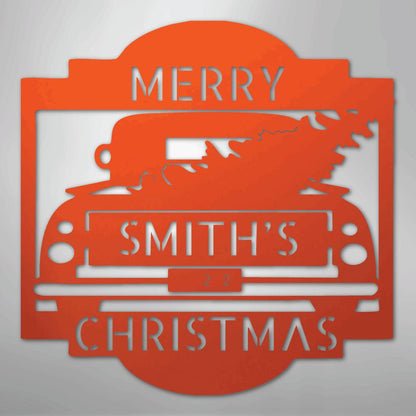 Orange metal Christmas truck monogram with "Merry Smith's Christmas" and a tree in the bed.