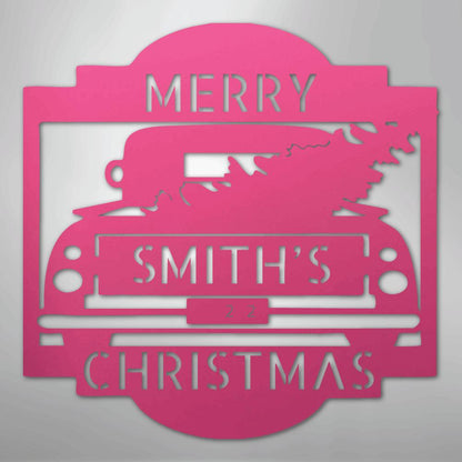 Pink metal Christmas truck monogram with "MERRY SMITH'S CHRISTMAS" and "22" cutouts.