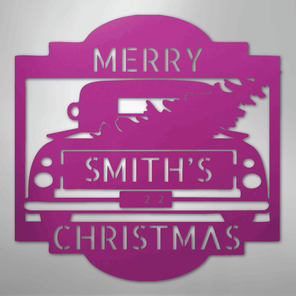 Pink metal Christmas truck monogram with "Merry Smith's Christmas" and "22" cutouts.