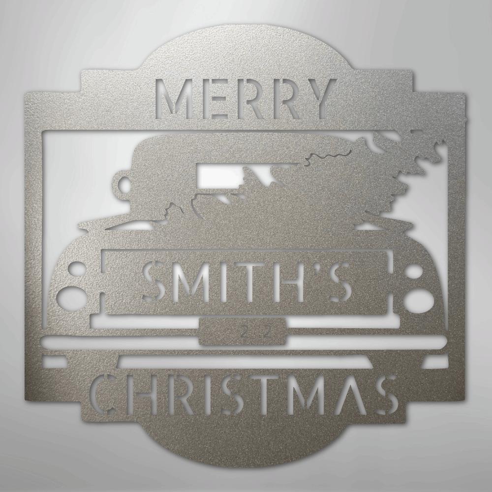 Silver metal Christmas truck monogram with "MERRY SMITH'S CHRISTMAS" cut out, featuring a tree in the truck bed.