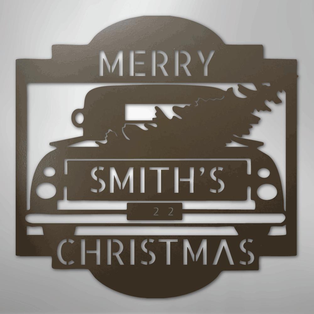 Brown metal Christmas truck monogram with "MERRY SMITH'S 22 CHRISTMAS" cut out.
