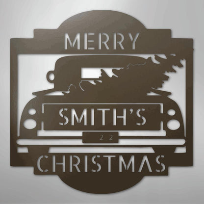 Brown metal Christmas truck monogram with "MERRY SMITH'S 22 CHRISTMAS" cut out.