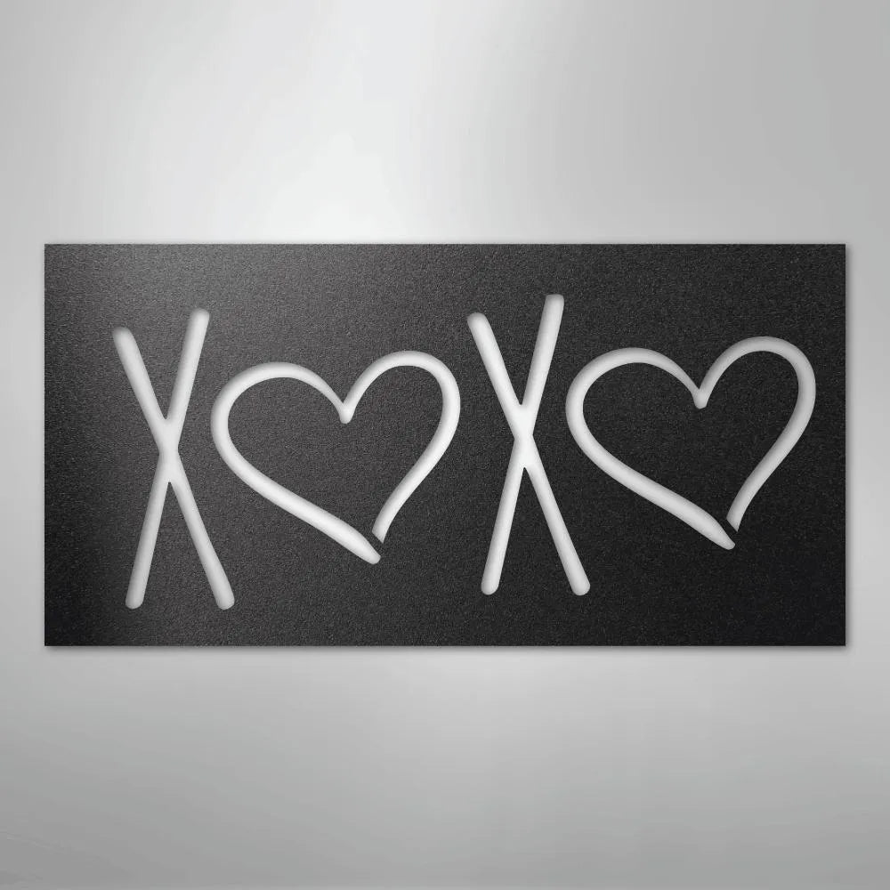 Black metal wall art with "XOXO" design, featuring two hearts, for indoor or outdoor decor.