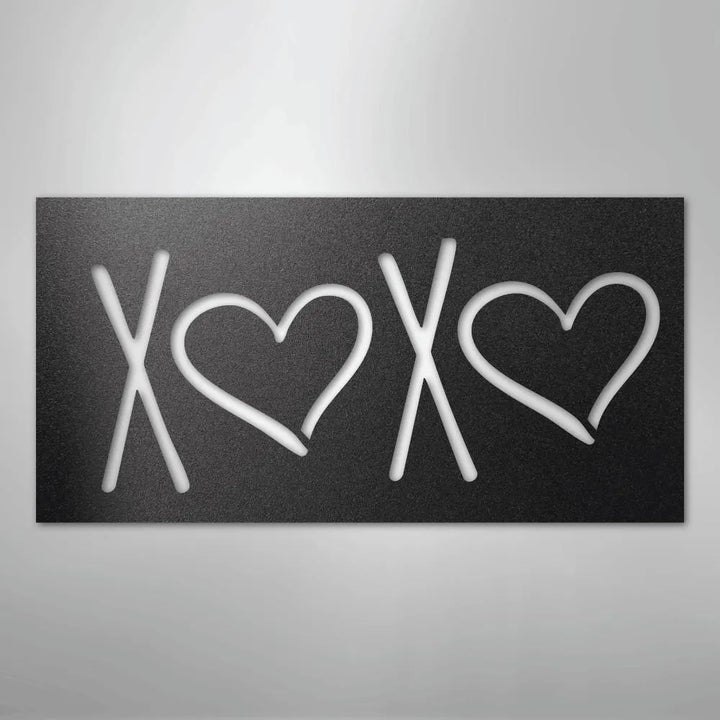 Black metal wall art with "XOXO" design, featuring two hearts, for indoor or outdoor decor.