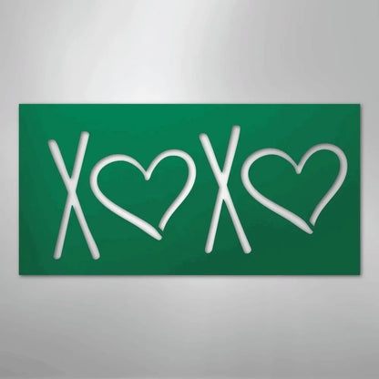 Green metal XOXO wall art with two hearts, powder-coated for indoor/outdoor use.