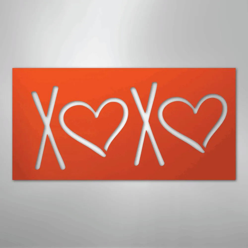 Orange metal wall art with "XOXO" cutout design, featuring two hearts.