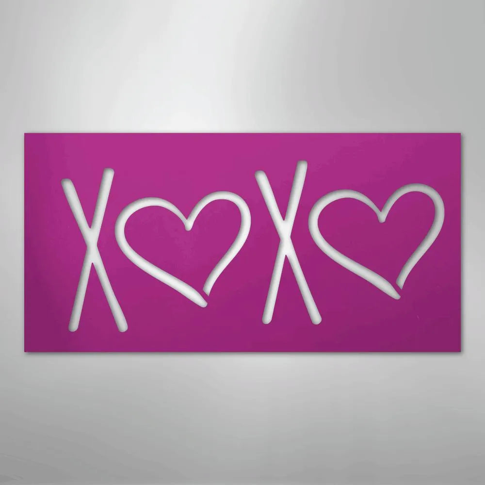 Pink rectangular metal wall art with "XOXO" cutout, featuring two hearts.