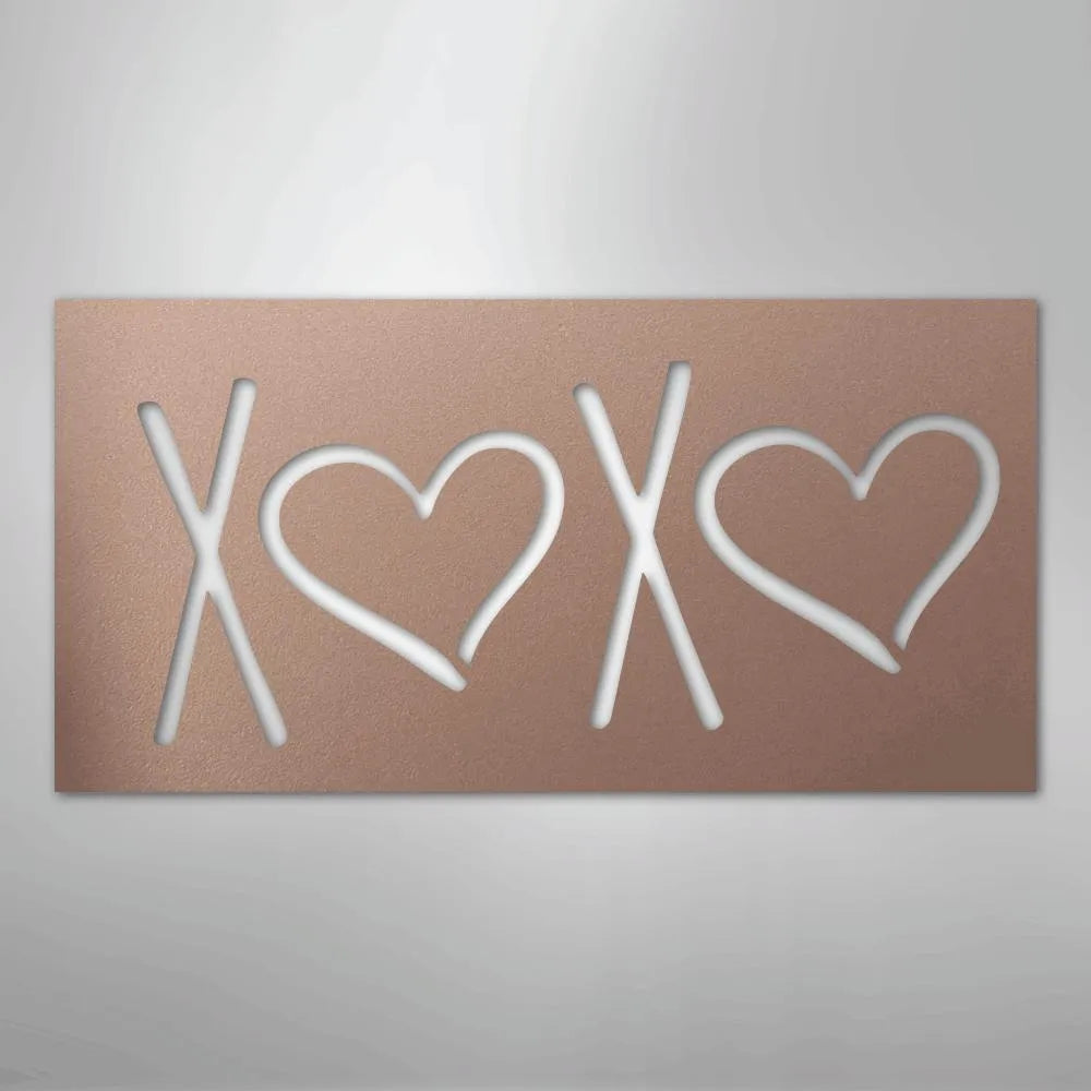 Rose gold metal wall art spelling XOXO with two hearts, perfect for indoor or outdoor decor.