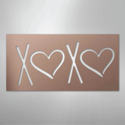 Rose gold metal wall art spelling XOXO with two hearts, perfect for indoor or outdoor decor.