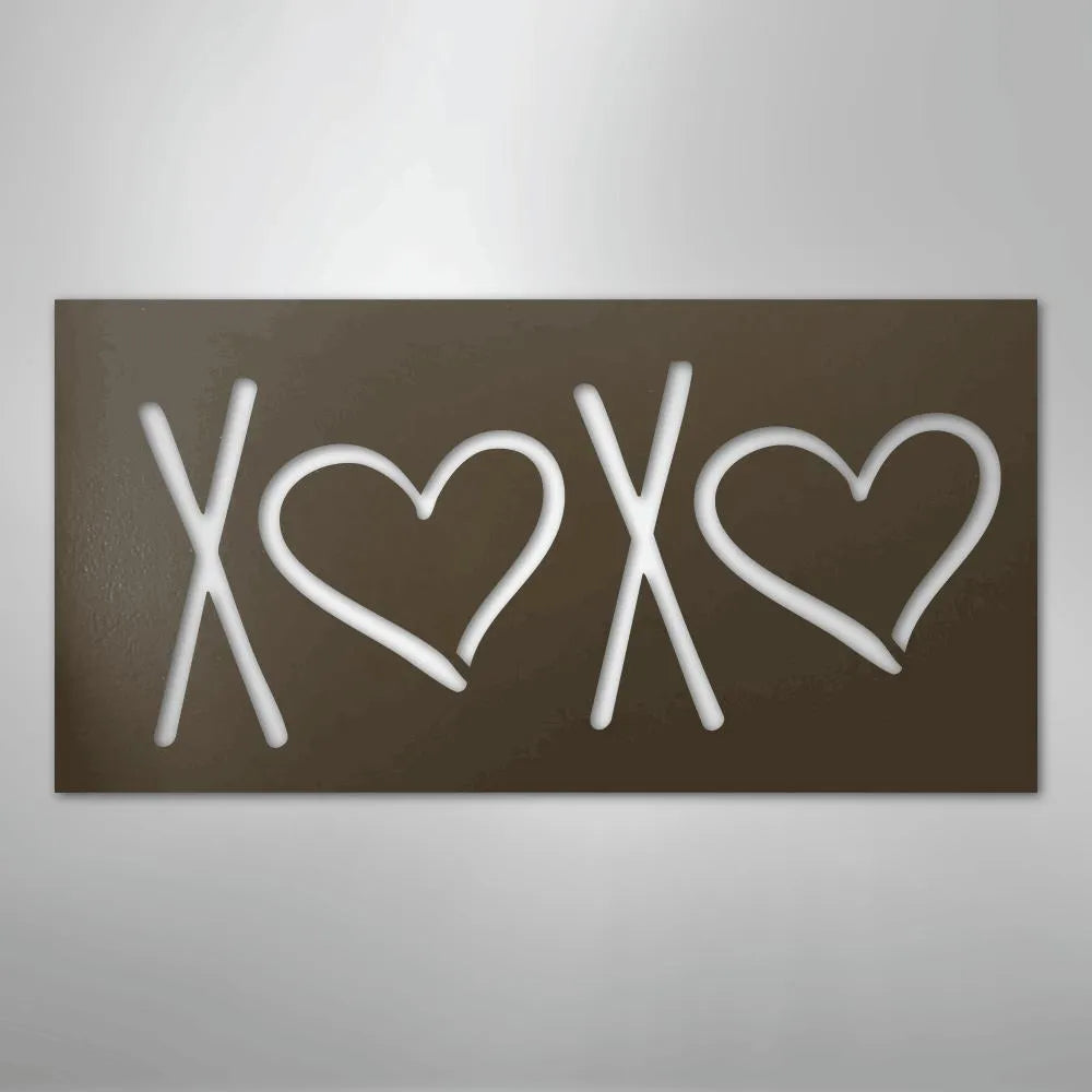 Brown metal XOXO wall art with cutout white letters and hearts.